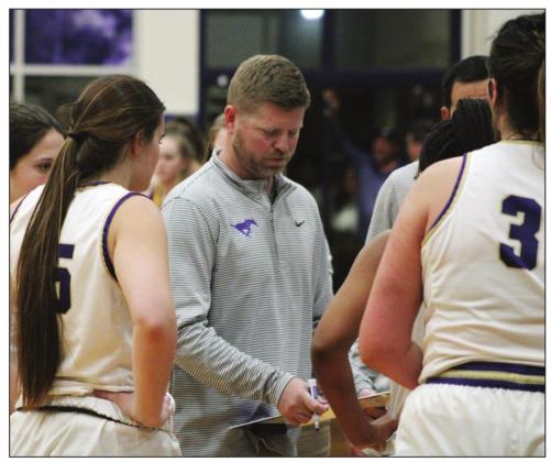 Lady Mustangs Head Coach John Berkman used his timeouts at the end of the game to draw up inbounding plays or calm the girls’ nerves before key free throws. The Lady Mustangs won 37-31 and moved to 2-2 in district play. Nathan Hendrix/The Highlander