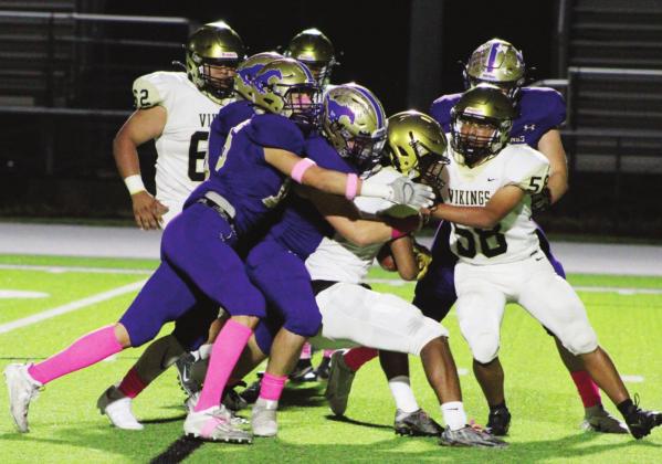 The Austin Navarro Vikings had a tough time on offense (above) as the Mustangs were in the backfield all night. Even if the backs broke a tackle, there were three or more purple shirts waiting for them. Photos by Nathan Hendrix/The Highlander