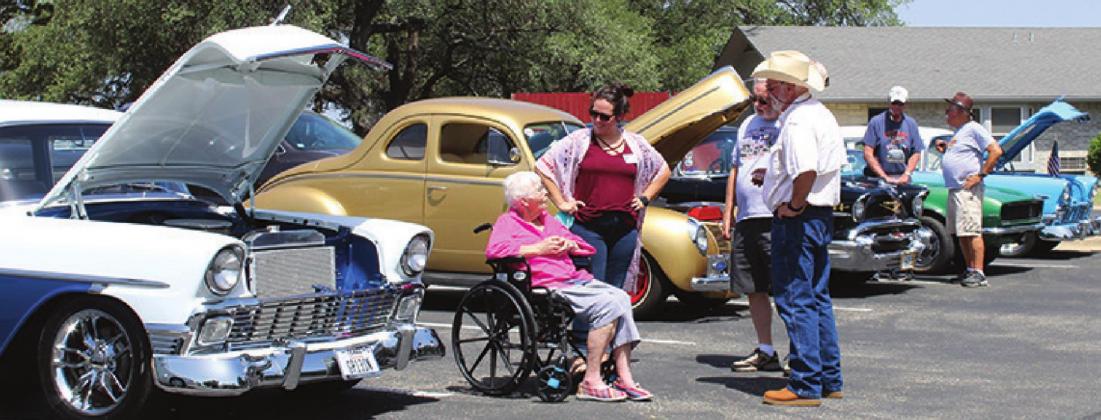 Classic vehicles lined up in the parking lot of Gateway Gardens/Gateway Villas in Marble Falls on Friday, June 17, co-hosted by the facility staff and members of the Lake Area Rods &amp; Classics.