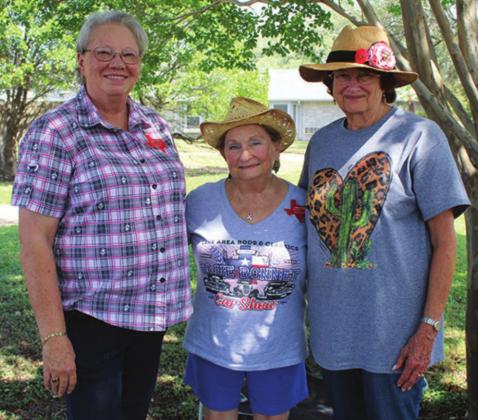 Sue Martin, Toni Kunkel and Judy Caramanica, all of Lake Area Rods and Classics, found a cool spot during the car show festivities on Friday, June 17 at Gateway Gardens in Marble Falls.
