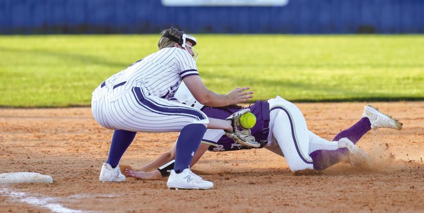 Marble Falls senior Aydan Ortis avoids the tag while sliding into third base during the loss to Lampasas March 19.