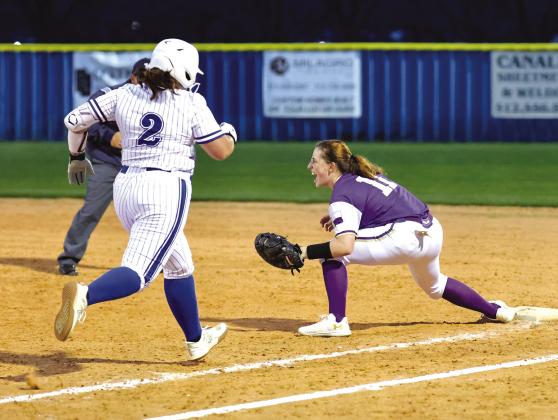 Marble Falls junior first baseman Sophia Biagini reacts to catching the ball for the out against Lampasas.