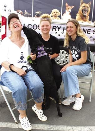 Hill Country Humane Society staff visited downtown Marble Falls on May 19 to ramp up efforts for free pet adoptions. Pictured, from left, Susan Kurdwig, Danielle Wolff and HCHS Executive Director Paighton Corley. Photos by Connie Swinney/The Highlander