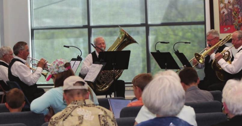The brass band which performed April 8 included (clockwise) Joe Mantheiy on trumpet; Bob Hutsko, trumpet; Bill Troiano, tuba; Weldon (Mac) McCutchen, trombone; and Michael LaCour, horn. Nelson Kovatch was unable to attend due to an illness. Raymond V. Whelan/The Highlander