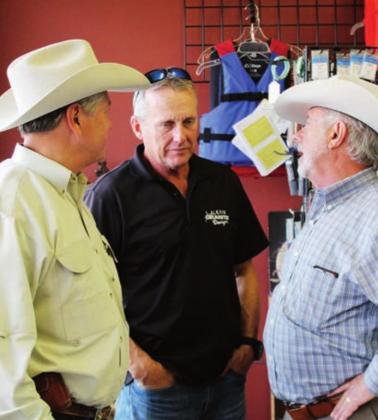 From left, Burnet County Pct. 4 Commissioner Joe Don Docker discussed issues with Marble Falls Mayor John Packer and Marble Falls EDC Board Member Dee Haddock.