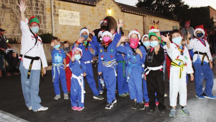Left: Family Tae Kwon Do Center was among the Light-Up Parade procession Nov. 20 on Main Street in Marble Falls. Photos by Connie Swinney/ The Highlander