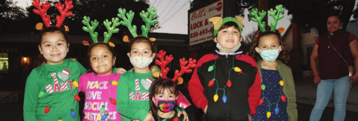 Below: Jareslie Sanchez, Hailey Gonzalez, Jameleth Sanchez, Emily Gonzalez (front), Jose Salazar and Keilany Salazar, all of Granite Shoals, enjoyed the Marble Falls Christmas parade Nov. 20. which also kicked of the Walkway of Lights.