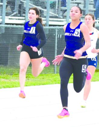 Marble Falls senior Ava Carter (left) and freshman Madison Cuplin compete in the 100 meters and team up as members of the 400-meter relay. Contributed/Coach Chris Schrader