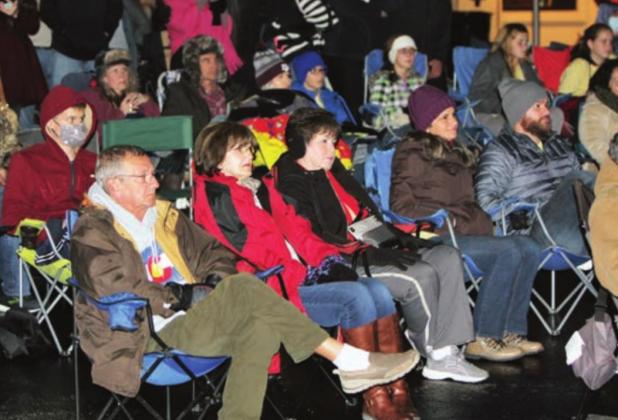 An all-ages crowd gathered to hear Christian music performer Josh Wilson, right, entertain Saturday, Dec. 5, following the Christmas Market on Main Street.