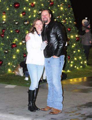 Nichole and Brian Herman of Marble Falls pose by the downtown Marble Falls Christmas tree on Main Street.