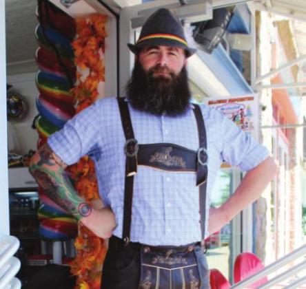 Justin Watson dons authentic lederhosen Monday on Main Street in Marble Falls in anticipation of his planned Oktoberfest event on the 22nd and 23rd of the month. Connie Swinney/The Highlander