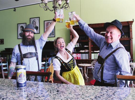 Oktoberfest will come to Marble Falls on Oct. 22 and 23 with the focal point being at Ragtime Oriole, 202 Main St., featuring German beer, live music and traditional heritage displays. Pictured, from left, are organizer Justin Watson, Ms. Lollipop’s Parties Gifts &amp; Fun downtown business owner Cheryl Westerman and Mayor Richard Westerman during a recent photo op to promote the event. Connie Swinney/The Highlander