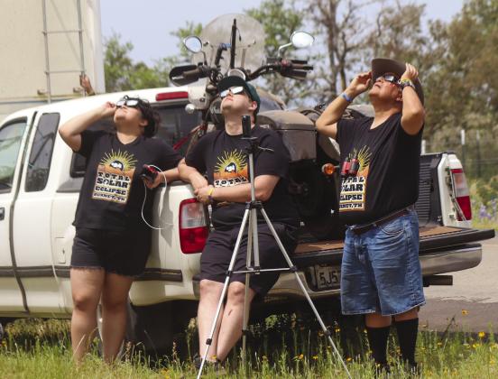 Aric Perez, Conrad and Chelsea Lucero from southern California viewed the Eclipse wearing their specially made Burnet Eclipse t-shirts Monday April 8 on County Road 114. Photos by Martelle Luedecke/Luedecke Photography