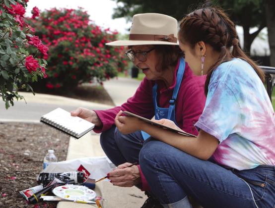 Artist and painter Debbie Heatley mentored Marble Falls High School sophomore Diana Flores on April 26 during the Paint the Town Festival. Activities open to the public are continuing through Saturday. Martelle Luedecke/Luedecke Photography
