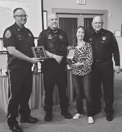 Lt. Cole Reasor, second from left, received the Preservation of Life Award from Police Chief Rocky Wardlow, far right, during Tuesday’s regular Horseshoe Bay City Council meeting. From left are Assistant Police Chief Jason Graham, Lt. Reasor, Camille Reasor, and Chief Wardlow. Contributed/City of HSB 