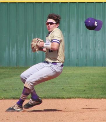 Right: Sophomore shortstop Jake Carter loses his hat playing a hard hit ground ball.