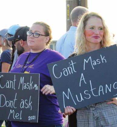Protestors arrived with signs opposing the mandating of masks. Connie Swinney/The Highlander