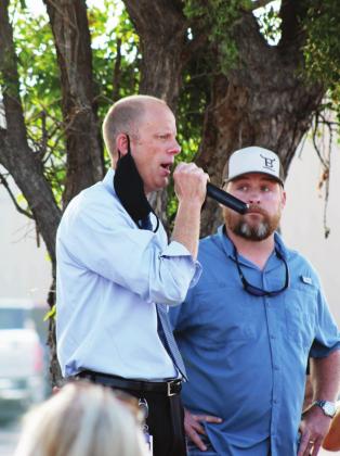 MFISD Superintendent Chris Allen (left) was asked by the crowd to speak in response to the things being said at the protest. Nathan Hendrix/The Highlander