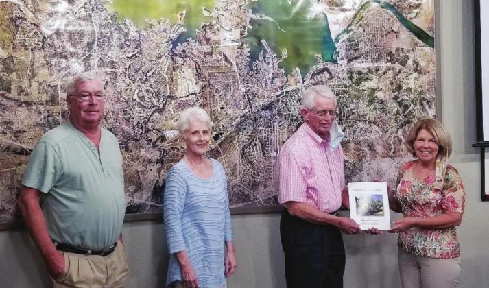 Author Jim Jorden presents Fuchs House Advisory Committee chair Francie Dix with the first copy of “A History of Conrad L. Fuchs Family and The Fuchs House” at Horseshoe Bay City Hall. Dix had won the copy during the silent auction held at the 2019 fundraiser golf tournament. “It was worth the wait!” Dix said. Contributed
