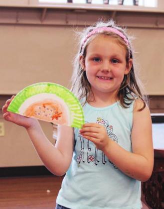 Paisley Miller, 7, participated in an arts and craft activity July 8 at the Boys &amp; Girls Club, Marble Falls unit. Employees assisted groups of no more than 20 in crafting their paper plate watermelon slices. Nathan Hendrix/The Highlander