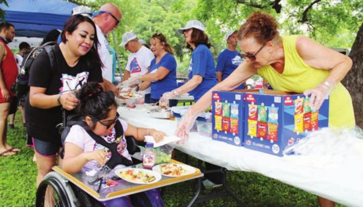 Lupita Gonzalez and Vaiola Garcia were among participants of Skiin’ with the Galilean June 8 in Johnson Park in Marble Falls. Spicewood resident Lynn Dobson volunteered at the event. Photos by Connie Swinney/The Highlander