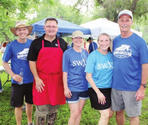 Pictured, from right, are event founder and director Todd Garrett and volunteers Rita Garrett, Sheri Devino, Ted Vananne and Chris Pitts.