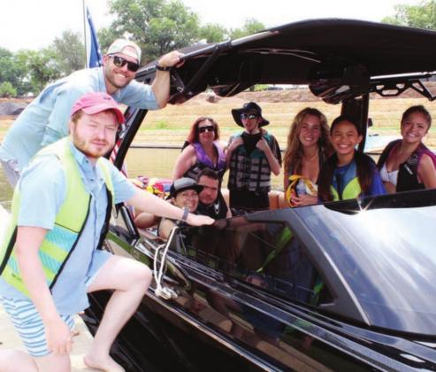 Matt Eppright, left, and Tanner Vaughan of Austin were among volunteers who escorted participants and families during Skiin’ with the Galilean June 8 in Johnson Park.