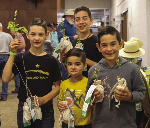 Tristan, Caleb, Liam and Declan Stokes have the makings for a bountiful garden after making their selections at the Hill Country Lawn and Garden Show on March 25.