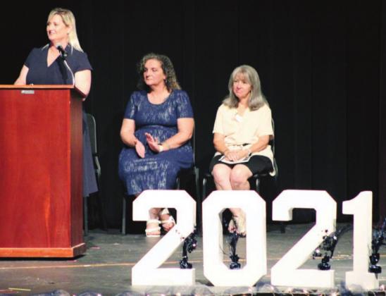 Falls Career Principal Allie Hampton welcomed family and friends to the graduation ceremony on Friday, May 28. She was joined on the stage by counselor Laura Harris and Falls Career administrative assistant Jeanette Tennison.