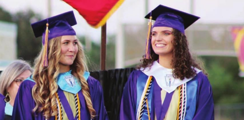 Above: Lyndsey Schwope, salutatorian, and Isabella Herman, valedictorian, receive a round of applause as they are introduced to the crowd at the start of the 2021 MFHS graduation.
