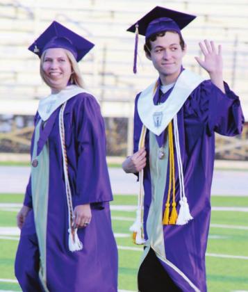 Graduates Jordan Oelschleger and Jonathan Randolph waved to their cheering families as they enter the field at the beginning of the MFHS graduation.