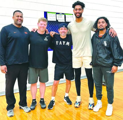 From left, Bryan Smith, John Berkman, Tonny Morelas, Merrin Mathew and David Morgan (not pictured) were among the adult participants Dec. 16 of the 3-on-3 basketball tournament held at the Mustang Gymnasium at Marble Falls High School.