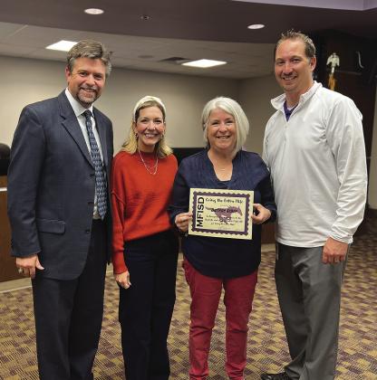 From left, Marble Falls ISD Superintendent Jeff Gasaway and Marble Falls Elementary School Assistant Principal Lauren Berkman presented Darlene Achee with the Going the Extra Mile Award Nov. 27. MFES Principal Michael Haley (right) participated in the award presentation.