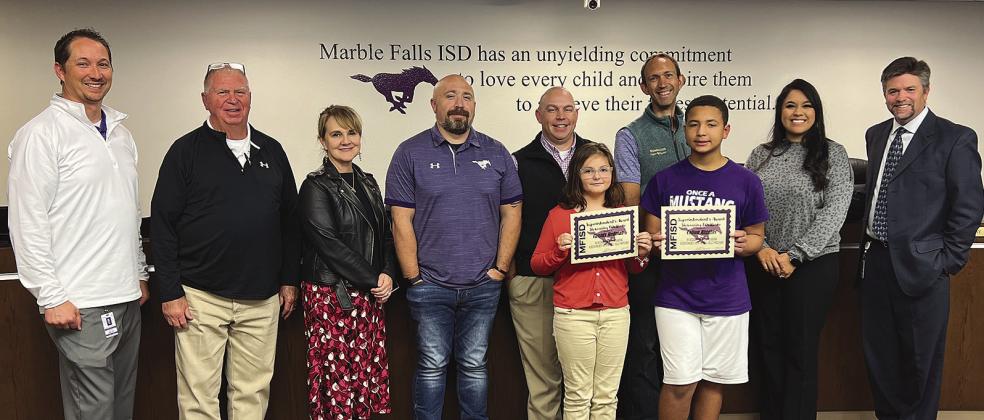 Pictured, back row from left, are: Marble Falls Elementary Principal Michael Haley and Marble Falls ISD board members Larry Berkman, Mandy McCary, Gary Boshears, Kevin Virdell, Alex Payson and Crystal Tubig with Superintendent Jeff Gasaway; and front row from left, Superintendent's Award recipients Cassidy Redman and Colton Higgins. Contributed Photos