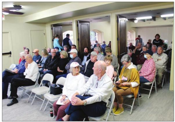 Concerned HSB POA property owners and residents wait to hear from directors Chuck Haven and Maria West about why they called a meeting to remove President Mike Thuss from the board. More than 100 people attended the two-hour meeting at Quail Point Lodge. Lew K. Cohn/The Highlander