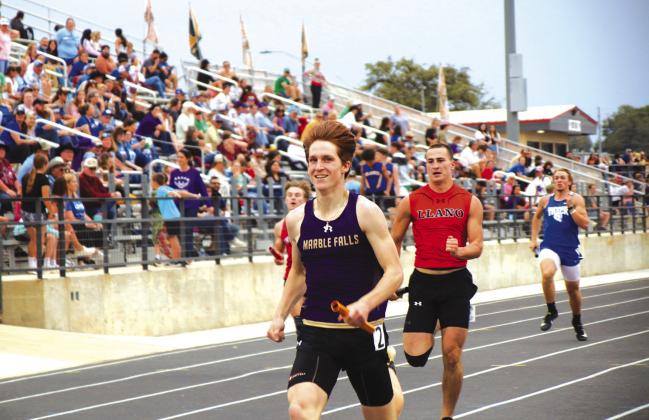 Zach Woody brings home the baton in the sprint relay at the Llano Relays Thursday, March 9. For the results from the meet see the Friday, March 17 issue of The Highlander. Photo by Luedecke Photography/Martelle Luedecke