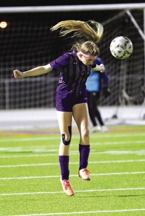 Marble Falls Irie Wallace heads the soccer ball in the Lady Mustangs 2-0 loss to Burnet in the regular season finale Friday, March 10 at Marble Falls. The playoffs start after spring break. Photo by Martelle Luedecke/Luedecke Photography