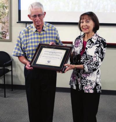 Jim Jorden, left, and Linda Lambert received framed certificates of appreciation from the city for spearheading a history book project which chronicles 50 years of Horseshoe Bay. Lew K Cohn/The Highlander