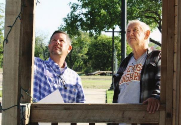 The 30th annual Walkway of Lights will expand features for visitors to include an ice rink on the grounds, additional lighted sculptures and a re-positioned entryway. Chamber Executive Director Jarrod Metzgar and Electrician Terry Evans, pictured here in 2019, are back again to lay the foundation for the Walkway of Lights setup in Marble Falls. Connie Swinney/The Highlander