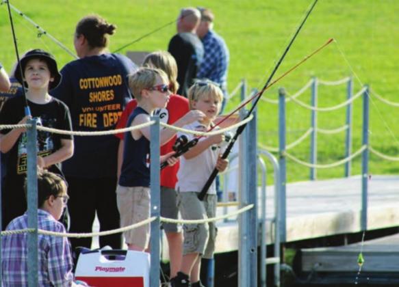 Several families participated in the Fishing with the Police event on Saturday, May 8. Cottonwood Shores Police Department hosted the event; the Cottonwood Shores Volunteer Fire Department also took part. Nathan Hendrix/The Highlander