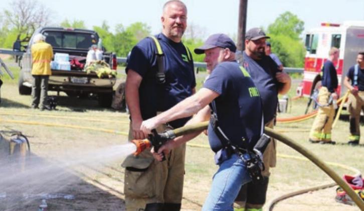 Above: MFAVFD Capt. Thomas Jacobs and MFAVFD Tim Elkins participate in a hose technique drill.