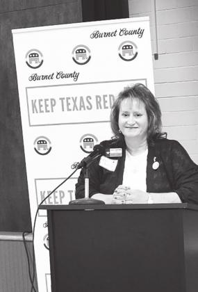 Burnet County GOP Chair Kara Green Chasteen welcomes attendees to the county’s Republican Party convention.
