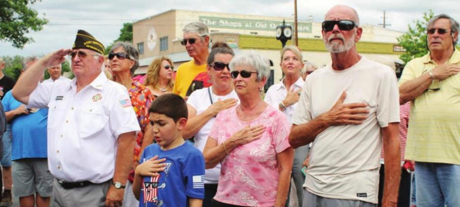 Dozens of attendees, several of which are pictured here, recited the Pledge of Allegiance June 1, led by Marble Falls VFW Post 10376 on Main Street. The event was organized by downtown merchant Belinda Kelley to inspire patriotism and unity. Photos by Connie Swinney/The Highlander