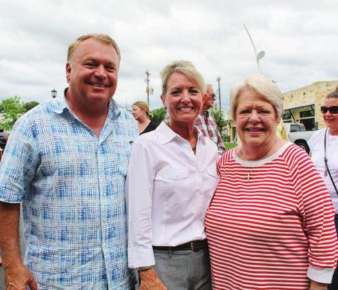 Mayor Richard Westerman and Marble Falls EDC Business Development Coordinator Midge Dockery joined flag re-installation organizer Belinda Kelley of Main Street Consignment at event June 1 in the heart of the city.