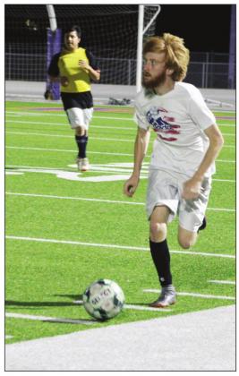 Mustangs soccer alumni Ty Gibson was among several former players to join the varsity team for the annual alumni game on Tuesday, Dec. 28. Nathan Hendrix/ The Highlander