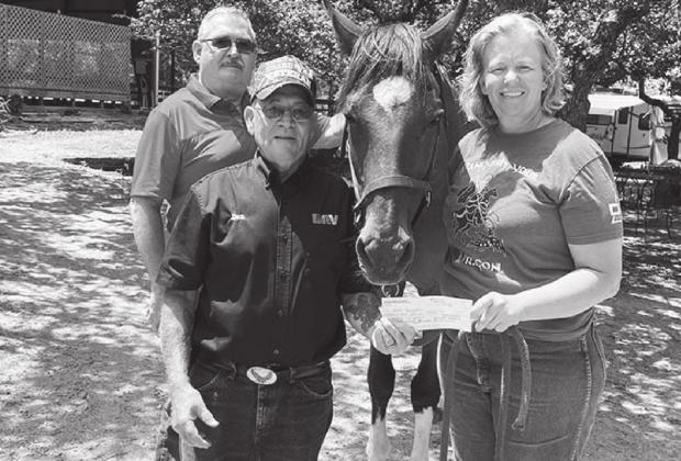 HARTH Foundation is excited to announce they have joined forces with Highland Lakes DAV Chapter 198 to provide equine-assisted services to even more disabled veterans in the local community. From left are Tom Walker, DAV Highland Lakes commander; Don Blakely, DAV Highland Lakes adjutant/treasurer (presenting check); horse Zar Zagano; and Jereny Johnson, HARTH Path certified instructor. Contributed