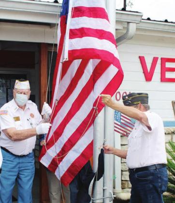 Members of VFW Post 10376 raised the U.S., Texas and POW/MIA flags on Sept. 10 at the headquarters, 1001 Veterans Avenue in Marble Falls. Photos by Nathan Hendrix/The Highlander 
