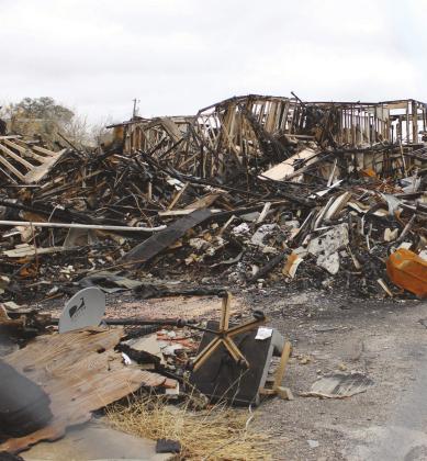 On March 7, the charred remains of the Mayfield Building, also known as the China Kitchen building, were scraped from the lots in downtown Marble Falls where a fire last Oct. 4 destroyed the businesses it housed. Connie Swinney/The Highlander
