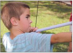 Dane VanEngelenhoven was among campers who participated in an archery lesson in Johnson Park over the weekend. Photo by Martelle Luedecke/Luedecke Photography