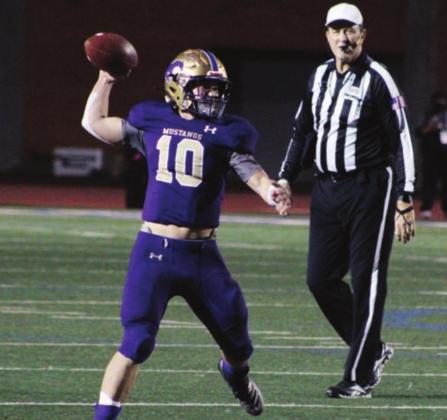 Above: Junior quarterback Jake Becker didn’t throw the ball many times in Friday’s playoff game, but two of his passes were critical. One converted a third and long, and another put two points on the board.